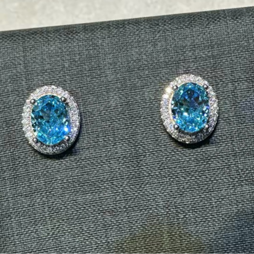 Sparkling Blue Oval Hybrid Diamond Stud Earrings
